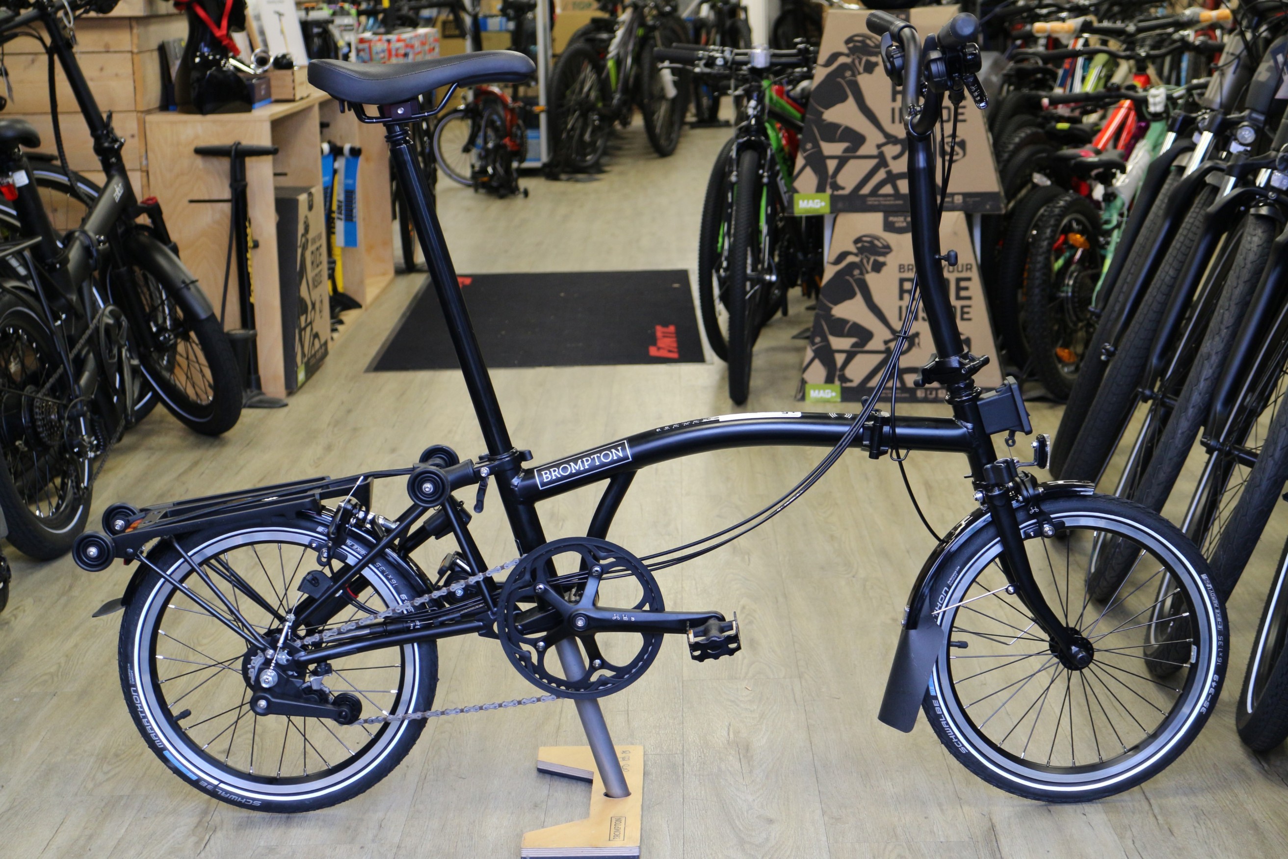 Brompton C Line Explore Mid Rack Black 2024 Folding Bike Damian Harris Cycles E bike specialist Cardiff UK